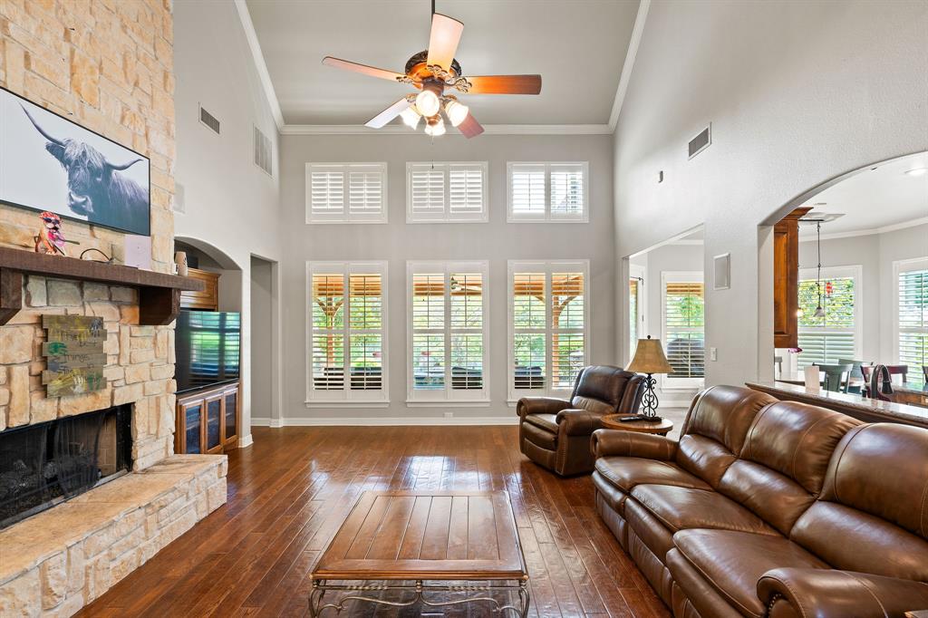 165 Whistler Lane Hallsville, TX 75650 - Photo 10 of 40 a living room with furniture a fireplace and a floor to ceiling window