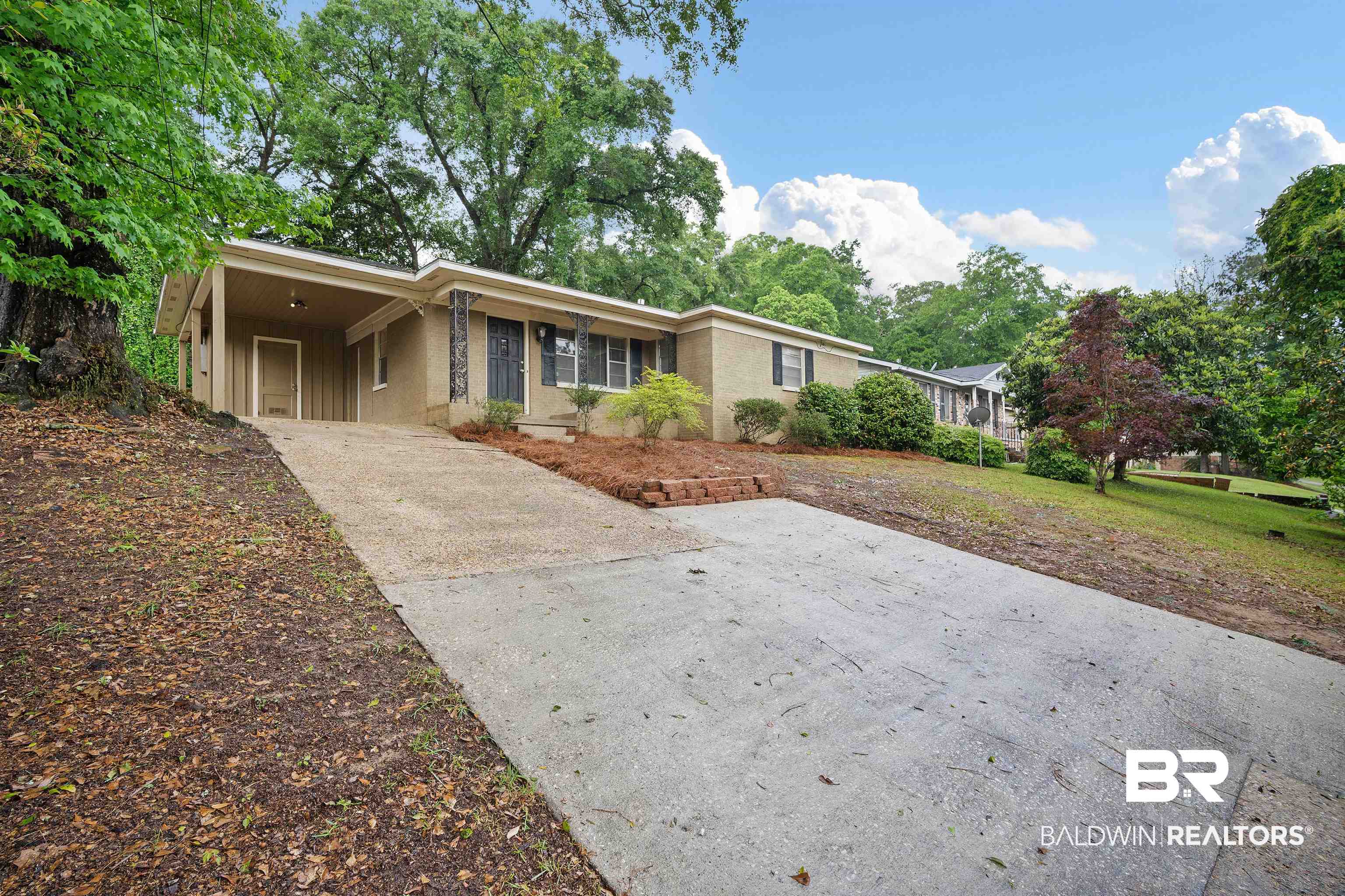 570 Markham Drive Mobile, AL 36609 - Photo 2 of 25 Ranch-style home featuring concrete driveway and an attached carport