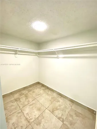 an empty room with a empty space and window