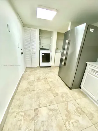 a view of a kitchen with a sink and a dishwasher