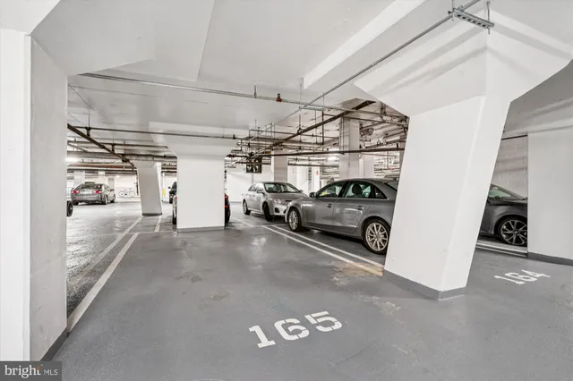 a view of parking garage with cars