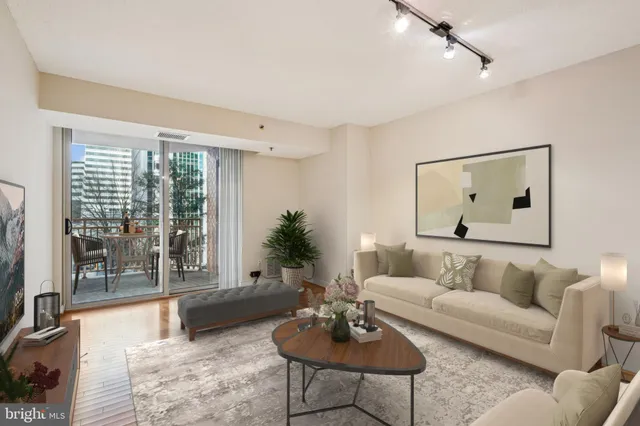 a living room with furniture and a large window