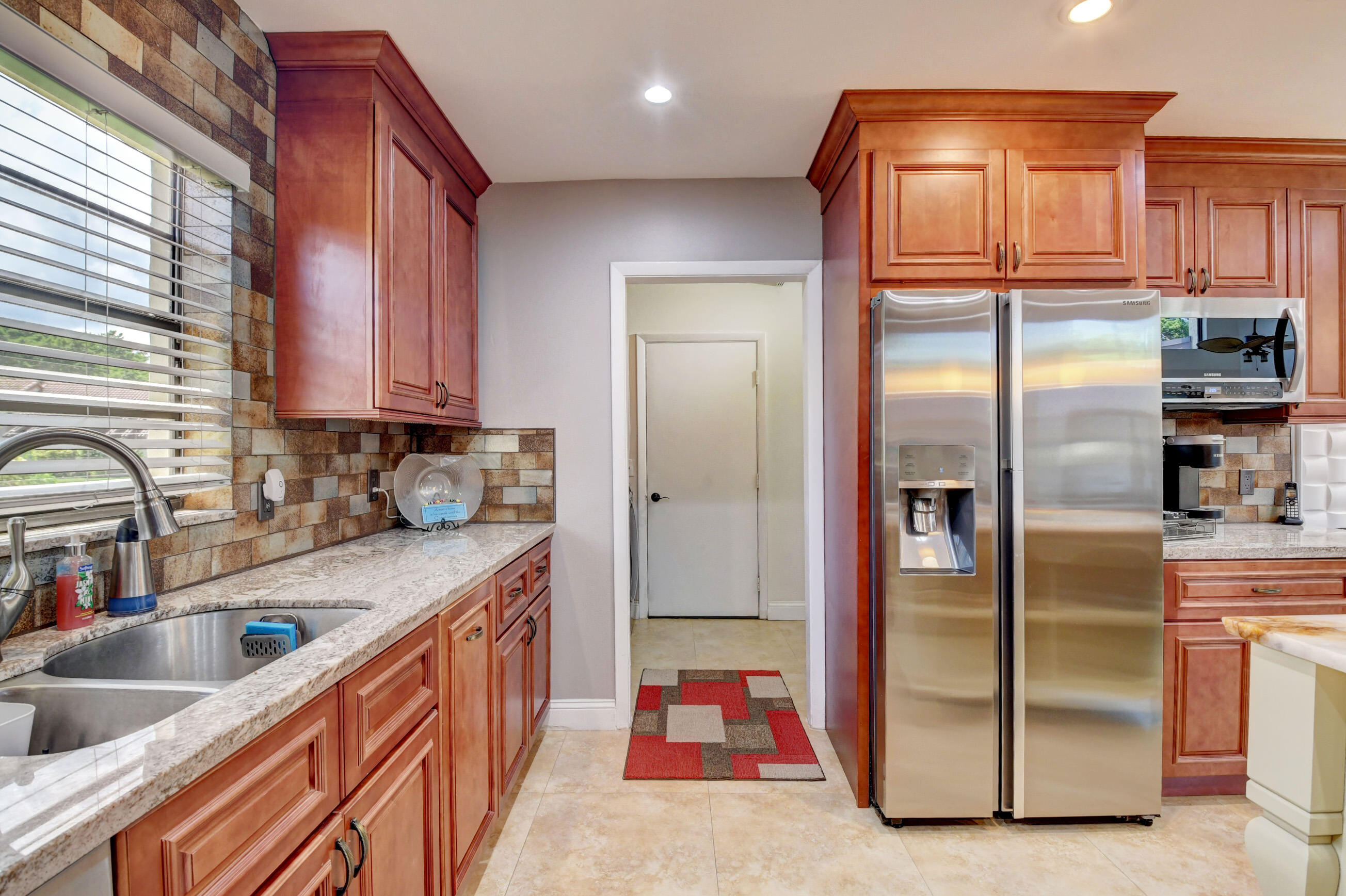 21933 Arriba Real, Unit 20B Boca Raton, FL 33433 - Photo 44 of 68 garage hallway