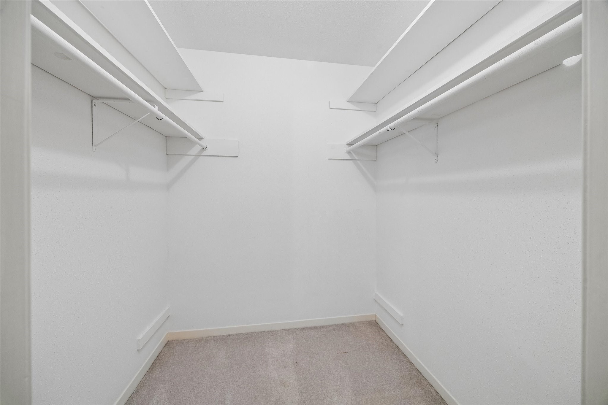 6659 Bayou Glen Road Houston, TX 77057 - Photo 13 of 23 One of two of the spacious walk-in closets in the primary bedroom. The other closet feature the full size washer and dryer.