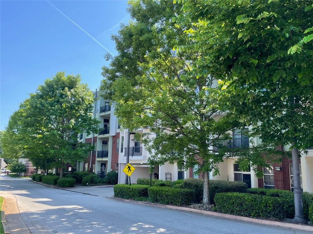 2630 Talley Street, Unit 221 Decatur, GA 30030 - Photo 1 of 1 a front view of a house with a yard and plants