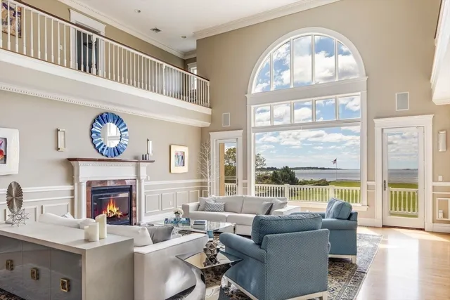 a view of a dining room with furniture wooden floor and chandelier
