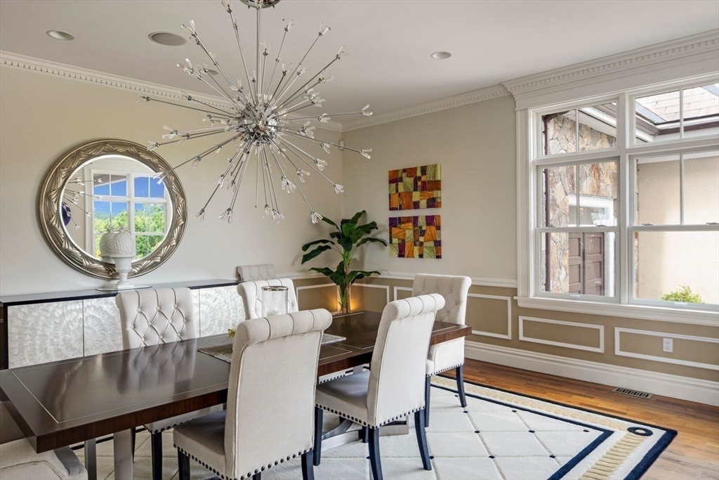 76 Paine Avenue Beverly, MA 01965 - Photo 19 of 41 a view of a dining room with furniture and a chandelier