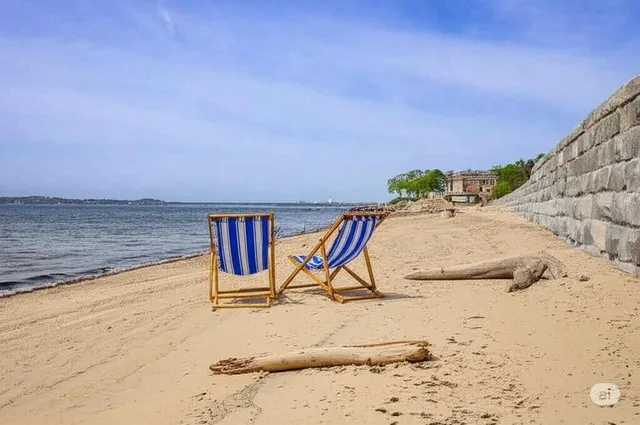 a view of swimming pool with seating space