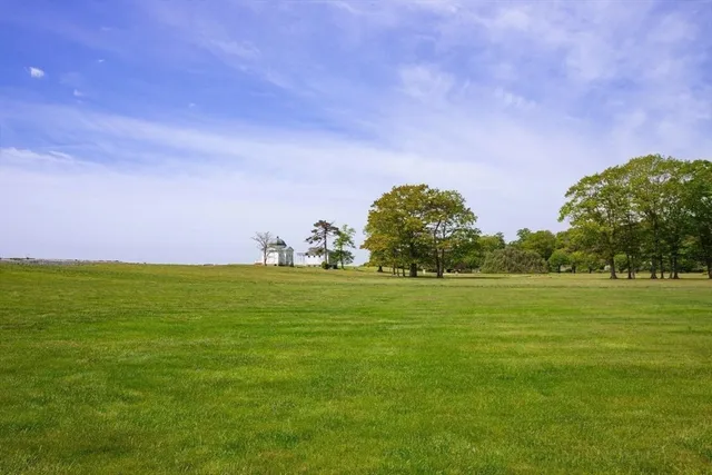 an aerial view of a house with garden space and street view