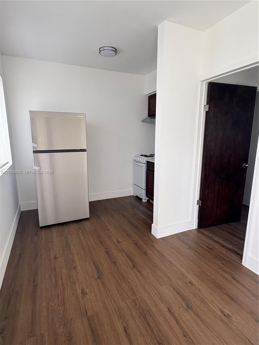2052 Southwest 7th Street, Unit 4 Miami, FL 33135 - Photo 3 of 10 a view of a room with wooden floor and a refrigerator