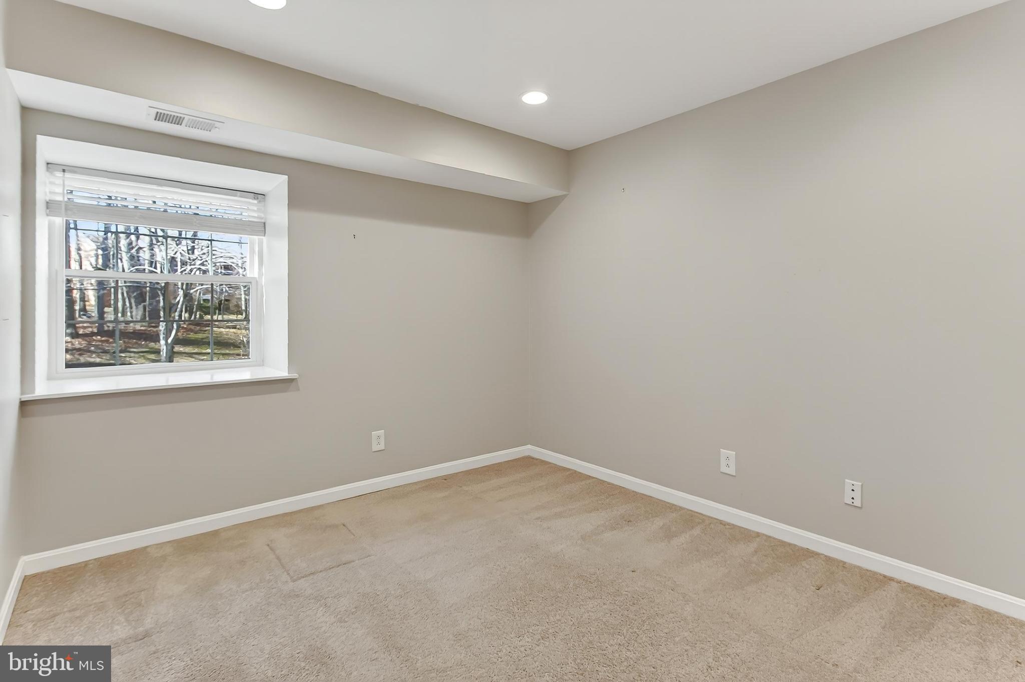 5833 Cove Landing Road, Unit 304 Burke, VA 22015 - Photo 26 of 34 a view of an empty room with a window