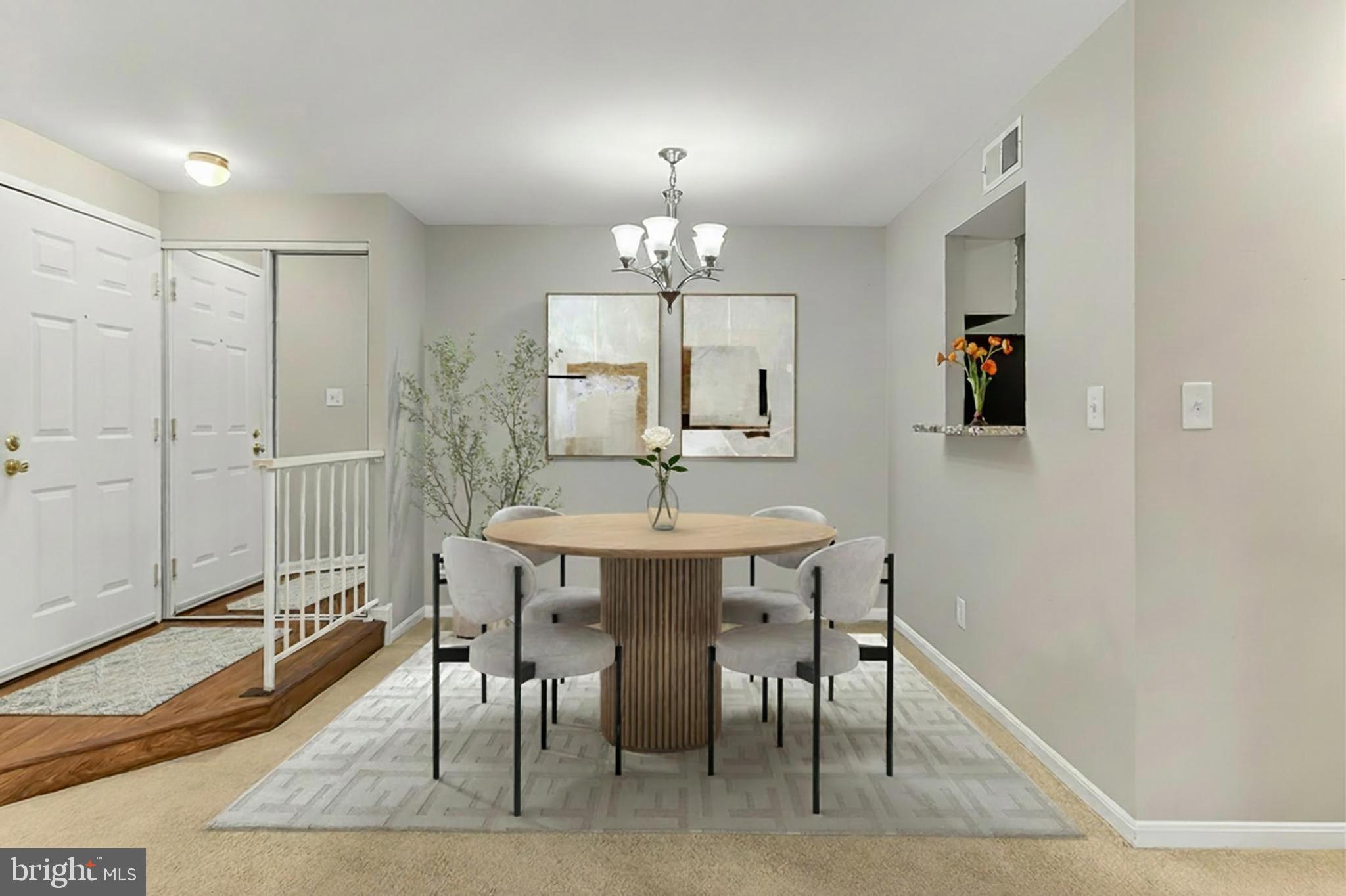 5833 Cove Landing Road, Unit 304 Burke, VA 22015 - Photo 3 of 34 a dining room with wooden floor a chandelier a wooden table and chairs