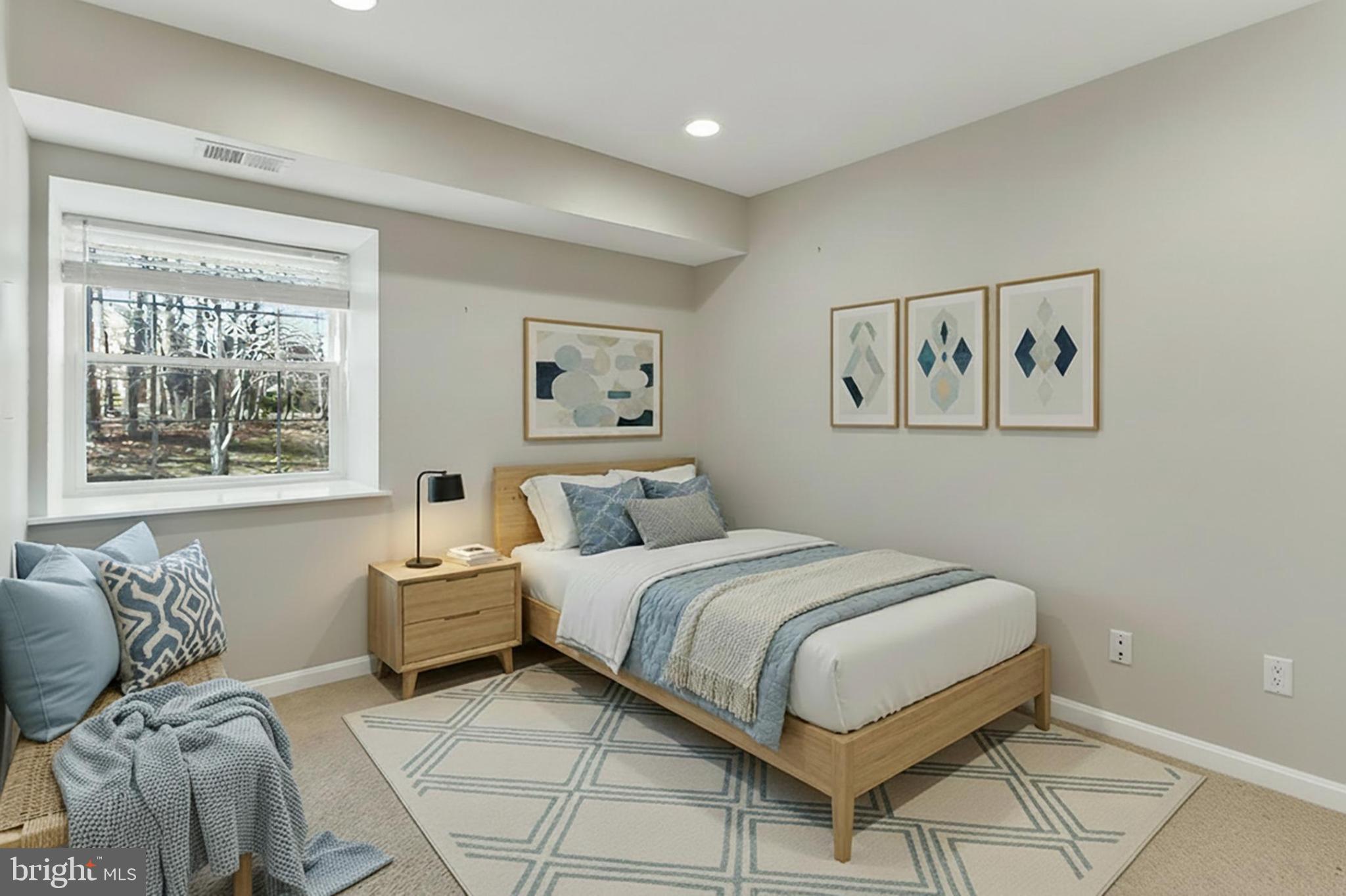 5833 Cove Landing Road, Unit 304 Burke, VA 22015 - Photo 5 of 34 a bedroom with a large bed and a window