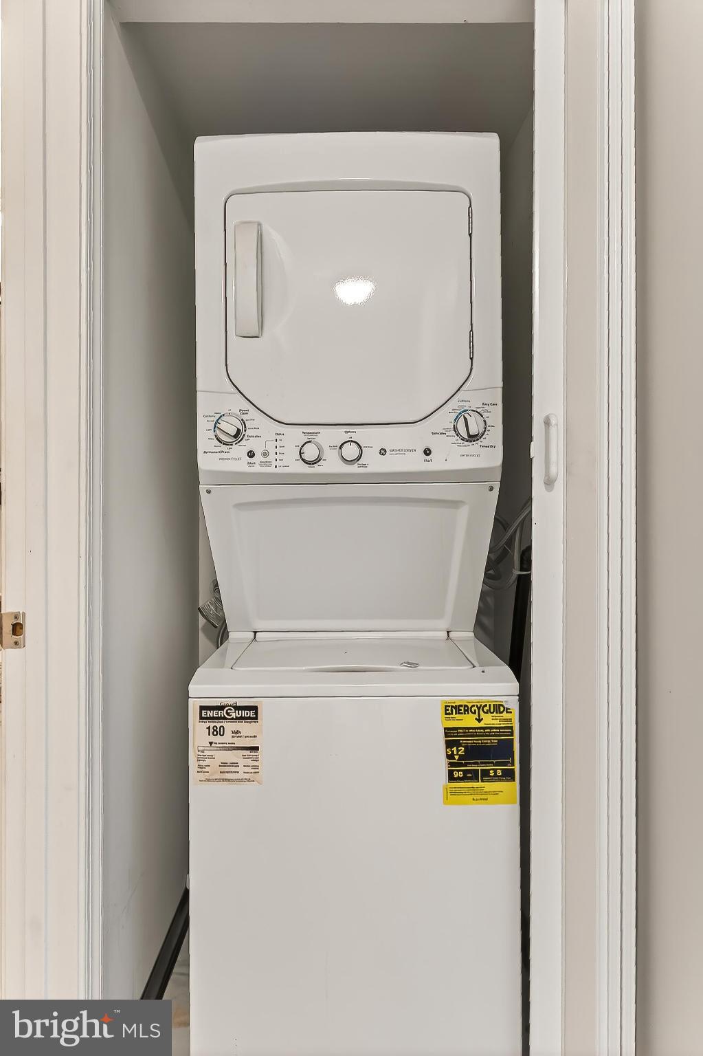 5833 Cove Landing Road, Unit 304 Burke, VA 22015 - Photo 9 of 34 a utility room with dryer and washer