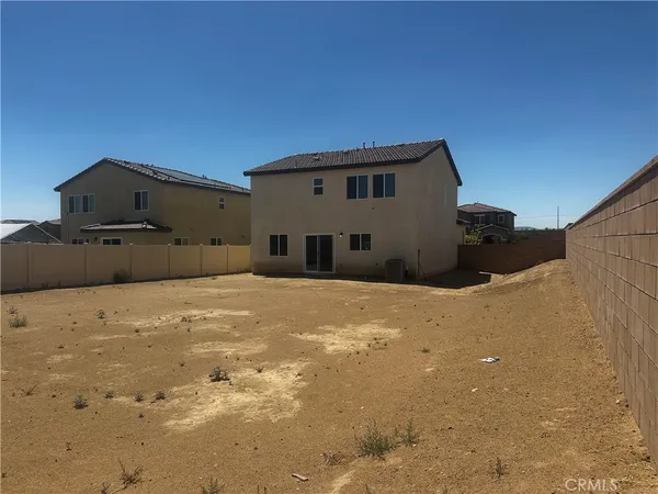 a house with a snow in the background