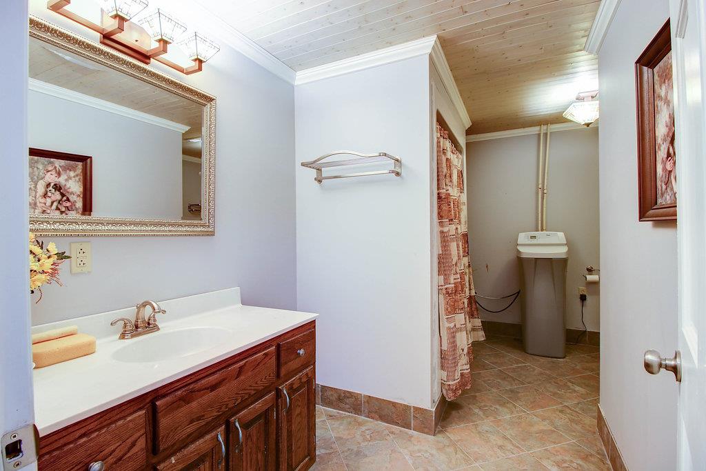 2727 Henry Gower Road Pleasant View, TN 37146 - Photo 16 of 30 a bathroom with a sink toilet and shower