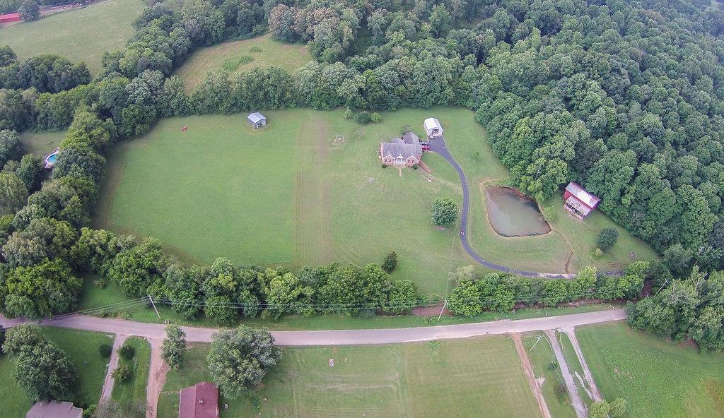 2727 Henry Gower Road Pleasant View, TN 37146 - Photo 22 of 30 an aerial view of a house with a yard and lake view