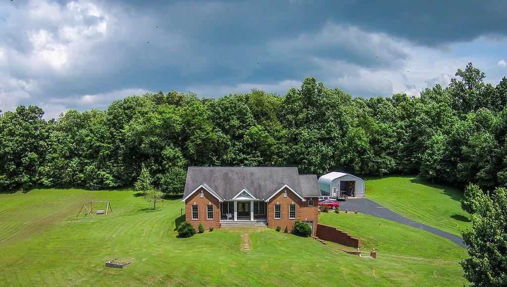 2727 Henry Gower Road Pleasant View, TN 37146 - Photo 23 of 30 a view of an house with swimming pool garden and trees