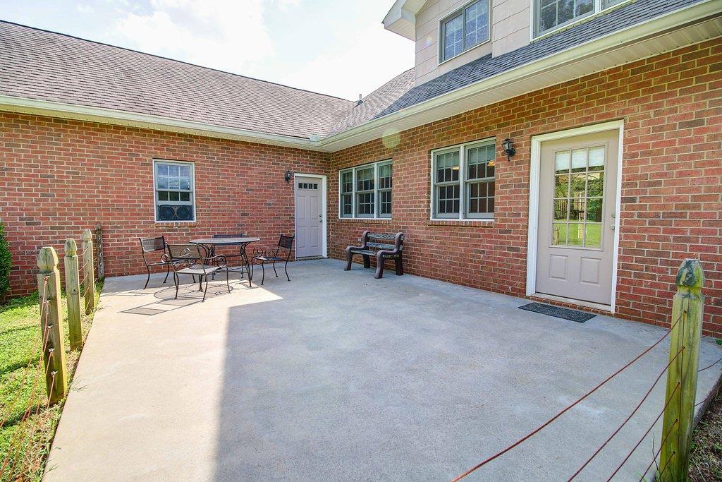 2727 Henry Gower Road Pleasant View, TN 37146 - Photo 29 of 30 a view of a house with outdoor seating