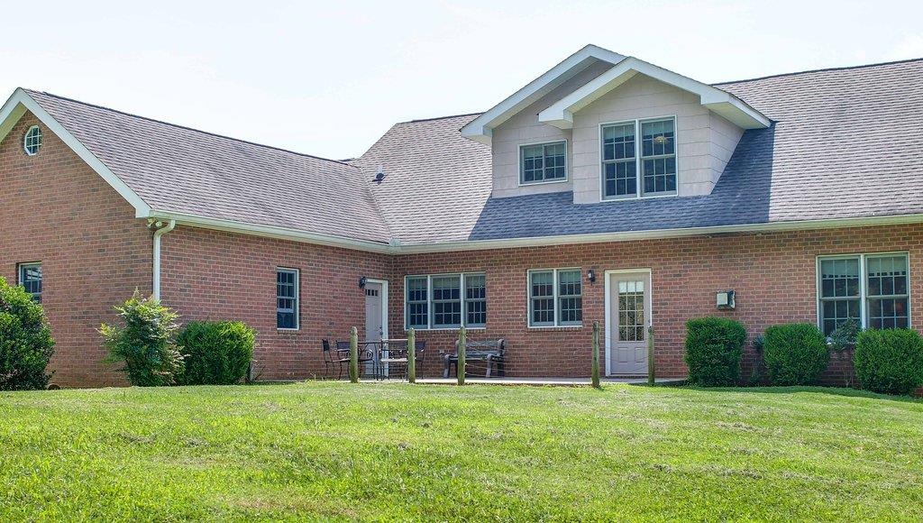 2727 Henry Gower Road Pleasant View, TN 37146 - Photo 5 of 30 a front view of a house with a yard and potted plants