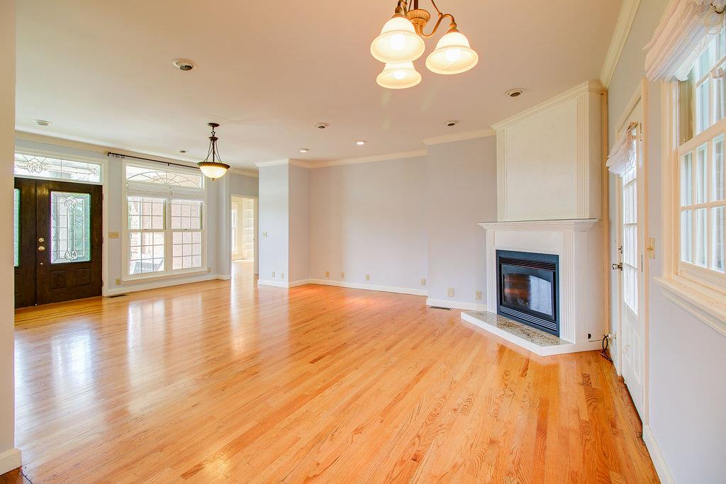 2727 Henry Gower Road Pleasant View, TN 37146 - Photo 7 of 30 a view of an empty room with wooden floor and a window