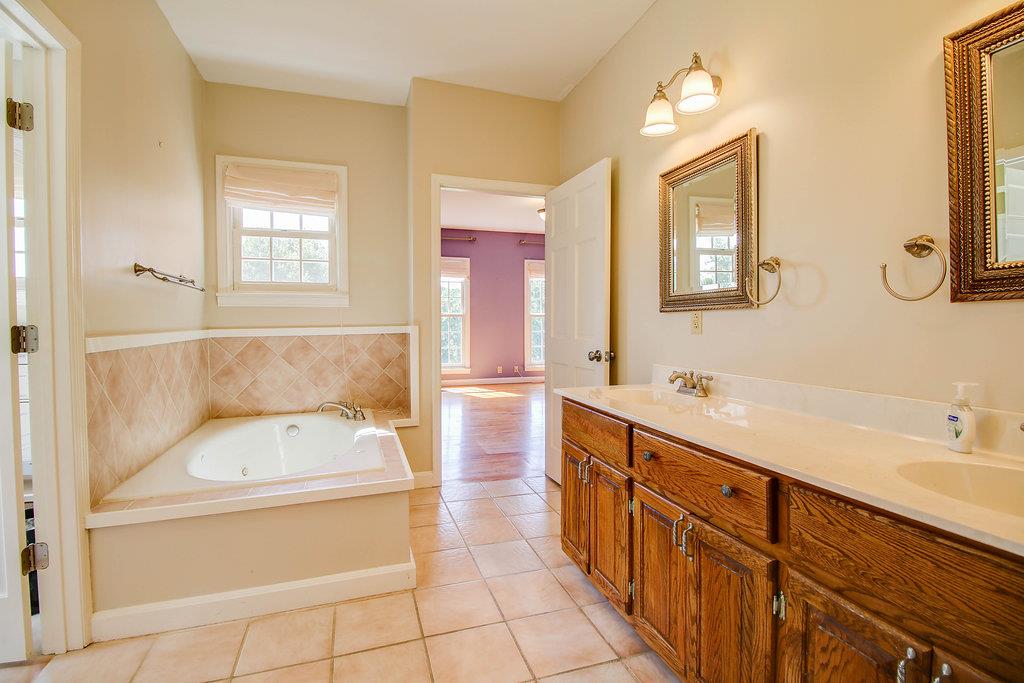 2727 Henry Gower Road Pleasant View, TN 37146 - Photo 9 of 30 a bathroom with a tub sink and mirror