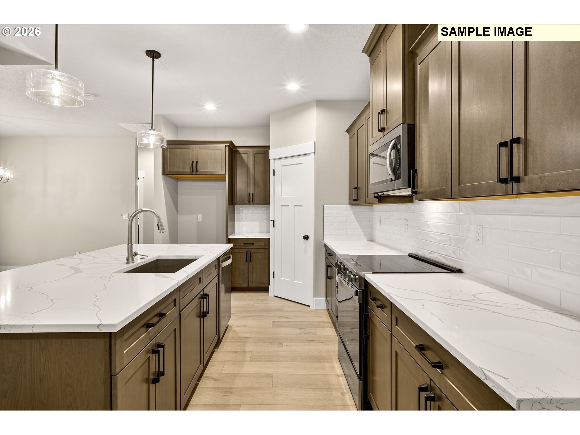 3352 Northeast Sweetwater Road, Unit 80 Estacada, OR 97023 - Photo 19 of 48 a kitchen with granite countertop a sink a counter top space stainless steel appliances and cabinets