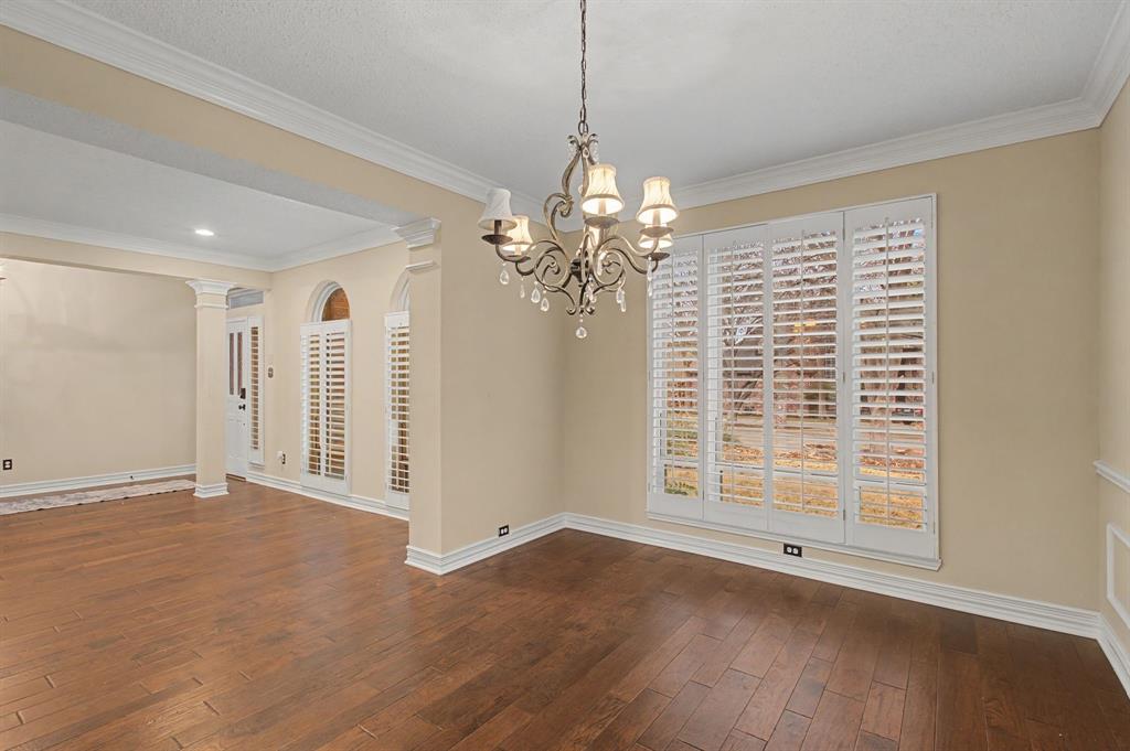 2705 Wind Ridge McKinney, TX 75072 - Photo 11 of 40 a view of a livingroom with wooden floor and a window