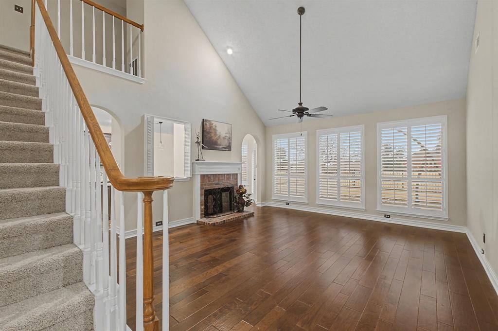2705 Wind Ridge McKinney, TX 75072 - Photo 12 of 40 a view of an entryway with wooden floor fireplace and a window