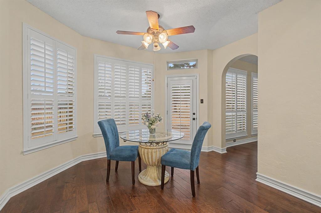 2705 Wind Ridge McKinney, TX 75072 - Photo 23 of 40 a view of a dining room with furniture and wooden floor