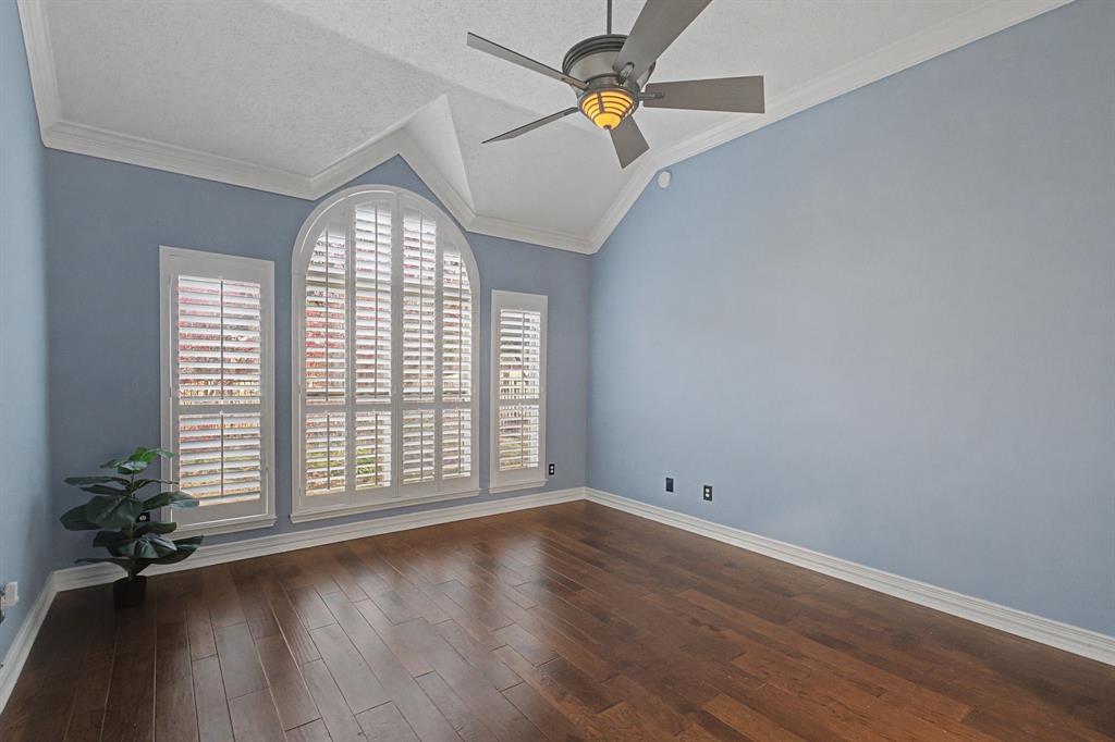 2705 Wind Ridge McKinney, TX 75072 - Photo 25 of 40 an empty room with wooden floor fan and windows