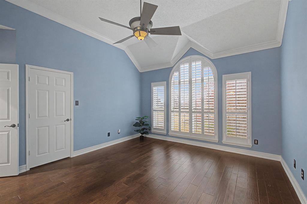 2705 Wind Ridge McKinney, TX 75072 - Photo 26 of 40 an empty room with wooden floor fan and windows