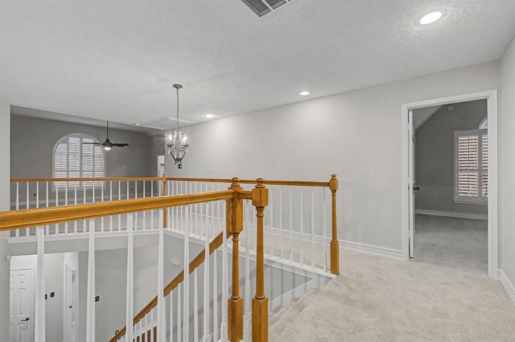 2705 Wind Ridge McKinney, TX 75072 - Photo 30 of 40 a view of entryway and hall with wooden floor