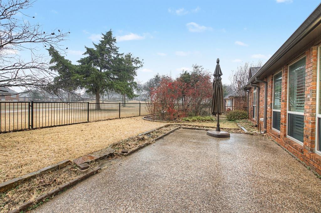 2705 Wind Ridge McKinney, TX 75072 - Photo 38 of 40 a view of a backyard with a slide