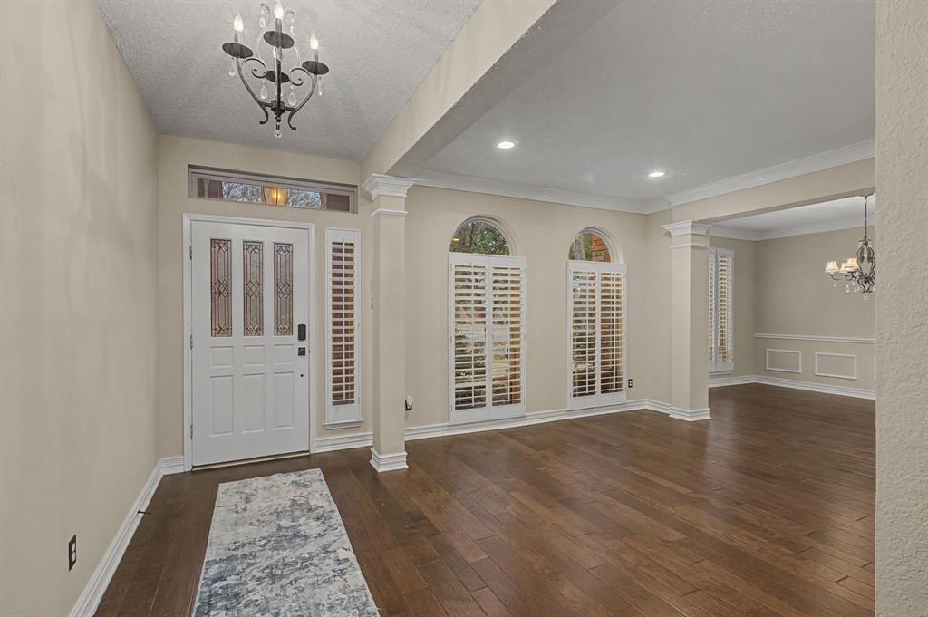 2705 Wind Ridge McKinney, TX 75072 - Photo 4 of 40 an empty room with wooden floor and windows