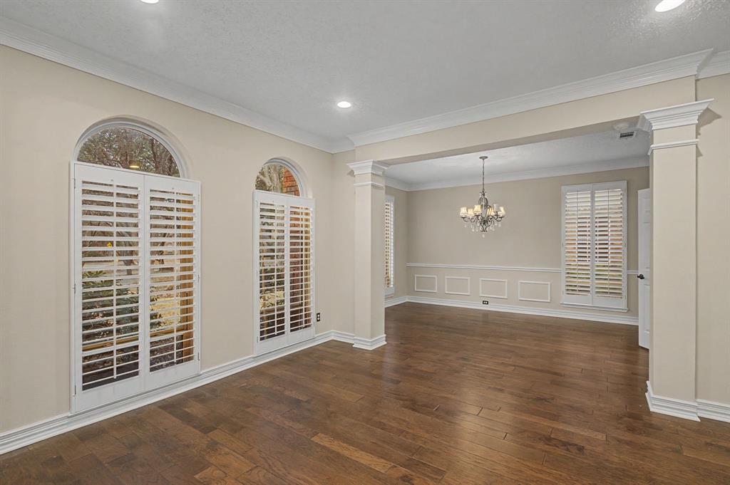 2705 Wind Ridge McKinney, TX 75072 - Photo 6 of 40 a view of an empty room with wooden floor and a window