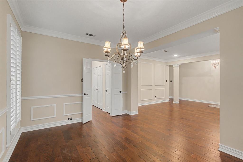 2705 Wind Ridge McKinney, TX 75072 - Photo 10 of 40 a view of a livingroom with wooden floor and a chandelier