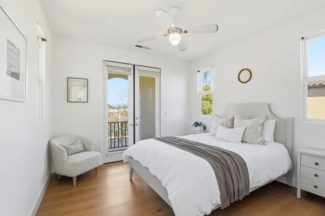 a bedroom with a bed and a couch