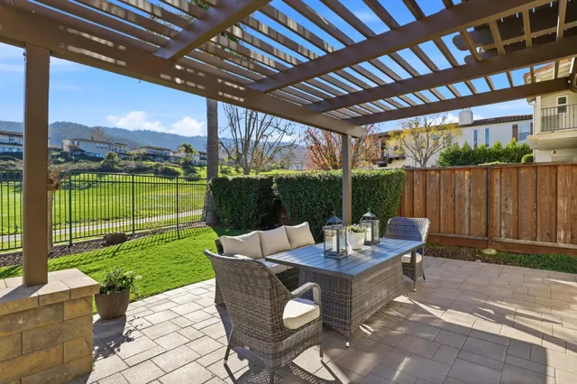 a view of a patio with a table chairs and a patio