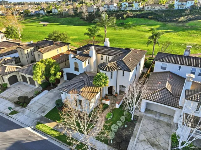 an aerial view of a house with a ocean view
