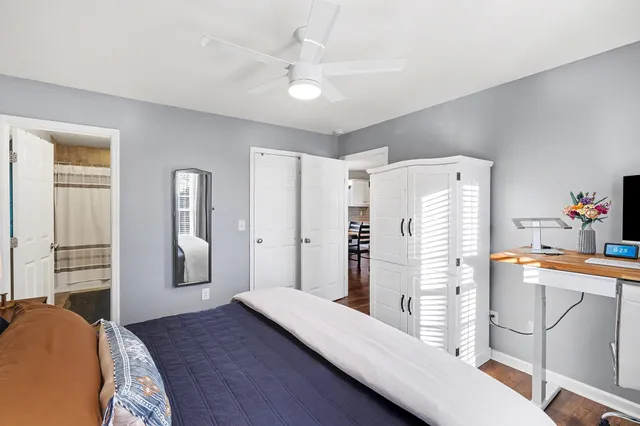 a bedroom with furniture and a walk in closet
