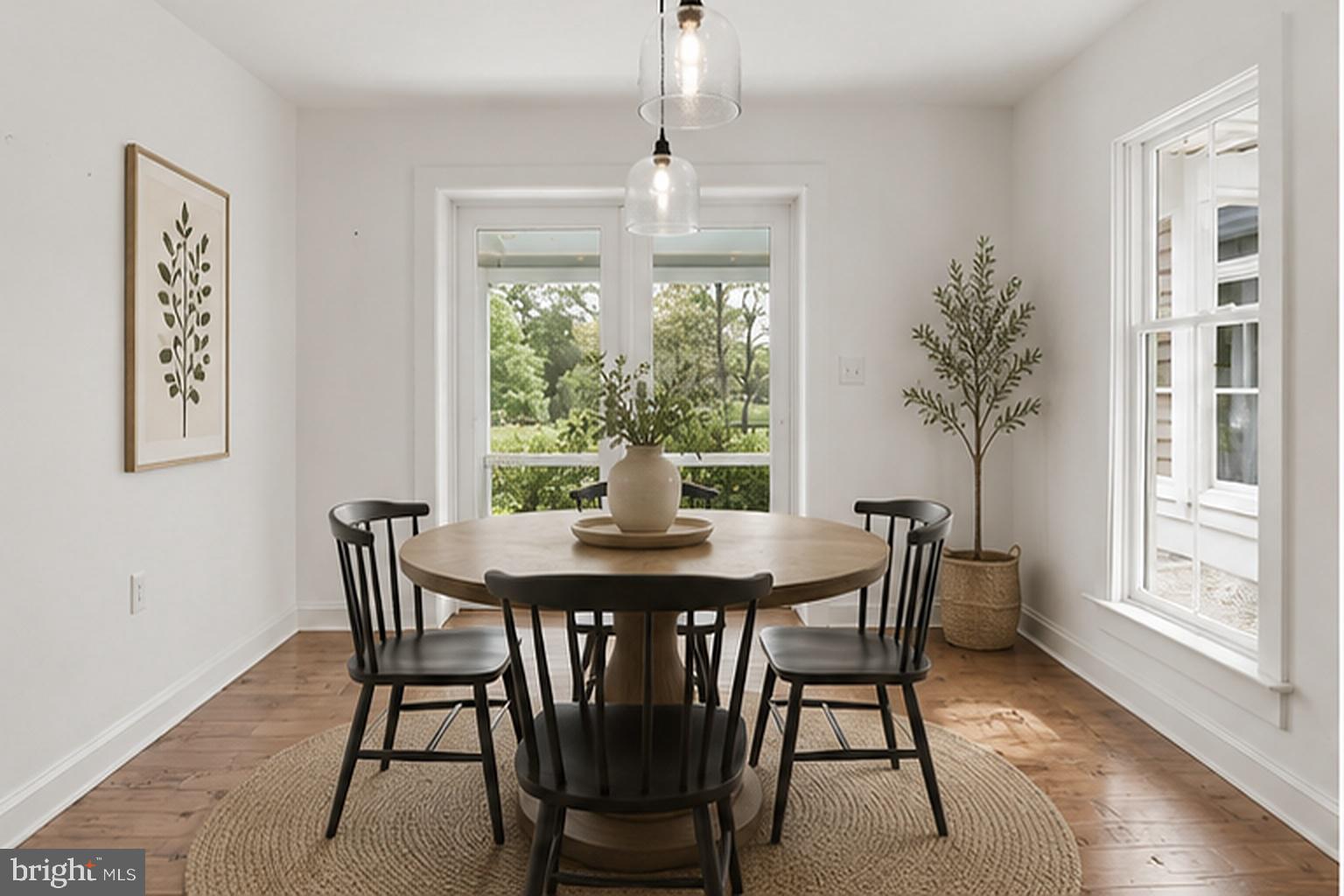 5865 Deale Beach Road Deale, MD 20751 - Photo 12 of 45 a view of a dining room with furniture window and wooden floor