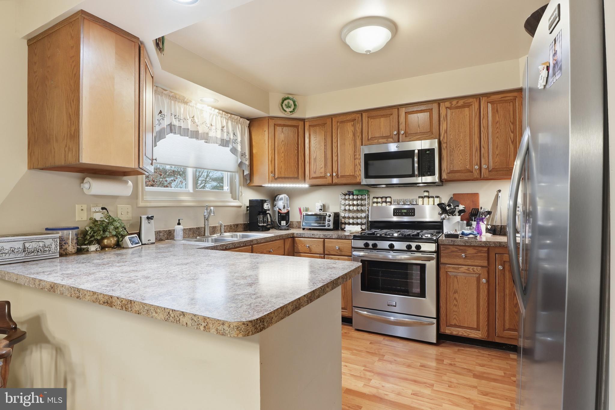 160 Greenleaf Road York, PA 17406 - Photo 9 of 46 Inviting kitchen with warm wood accents.