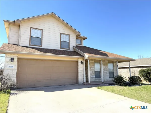 a backyard of a house with yard and garage
