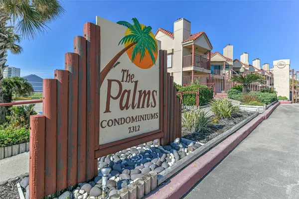 a view of a swimming pool in front of buildings