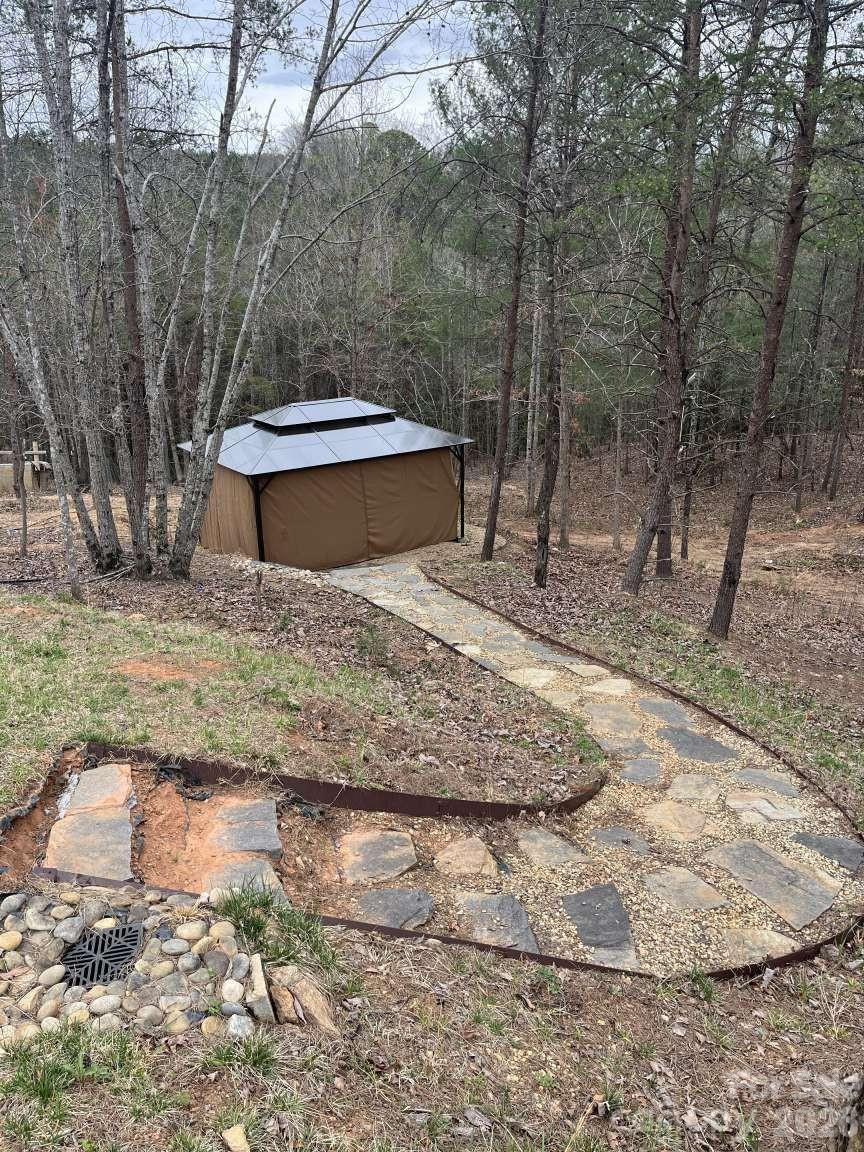 3445 Irish Hills Road Morganton, NC 28655 - Photo 28 of 34 a view of a backyard with trees
