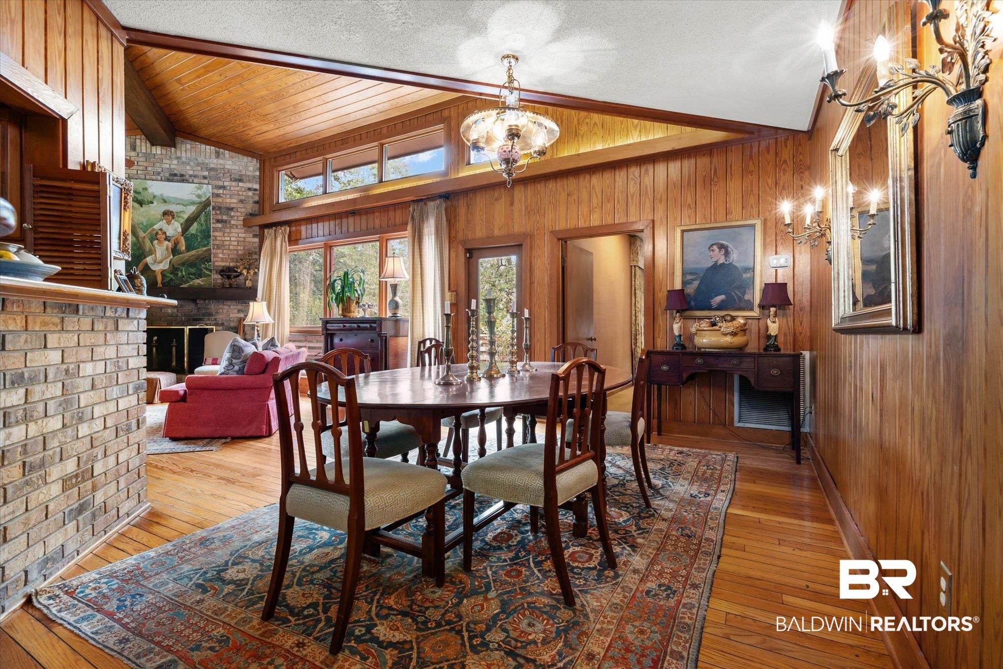 3500 Venetia Road Mobile, AL 36605 - Photo 6 of 56 Dining area featuring wood-finish flooring, wood paneling, a vaulted wood-finish ceiling, and a chandelier
