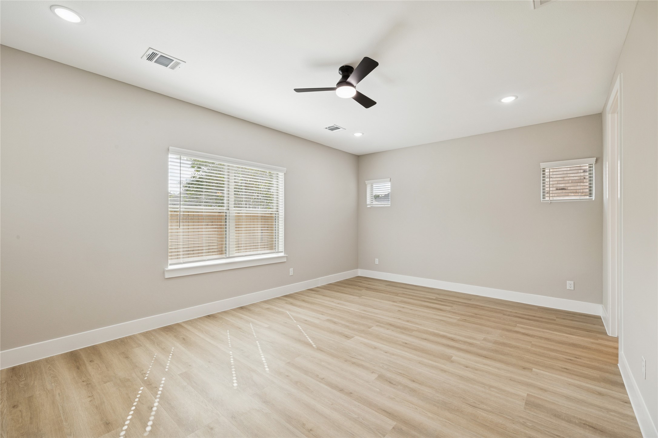 2602 Martinas Ct Spring Spring, TX 77388 - Photo 11 of 24 a view of an empty room with a window and wooden floor