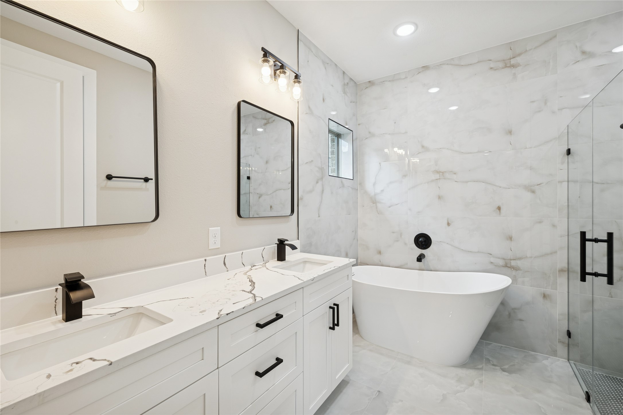 2602 Martinas Ct Spring Spring, TX 77388 - Photo 13 of 24 a bathroom with a double vanity sink mirror and bathtub
