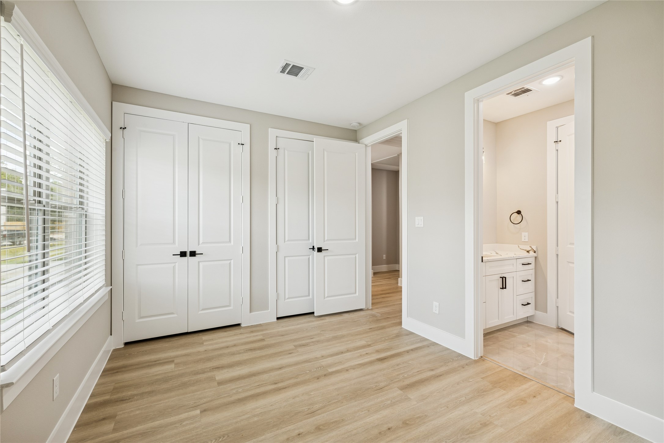 2602 Martinas Ct Spring Spring, TX 77388 - Photo 22 of 24 a view of a hallway with an empty room and wooden door